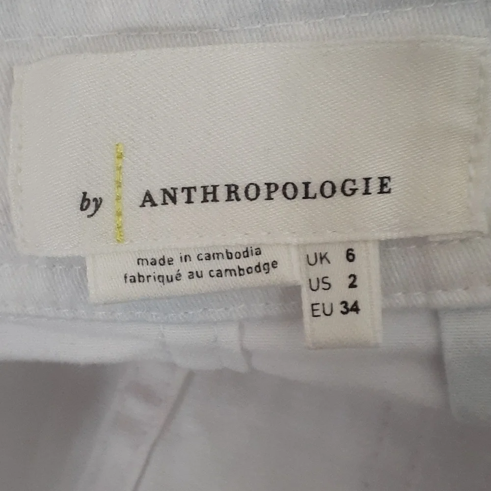 Anthropologie laying button silhouette